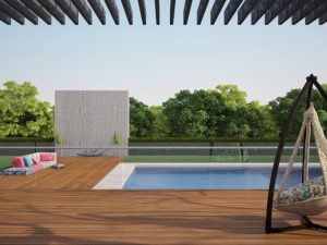 Modern glass pool fence around a sleek pool with wooden deck, pergola, hammock chair, and outdoor seating area.