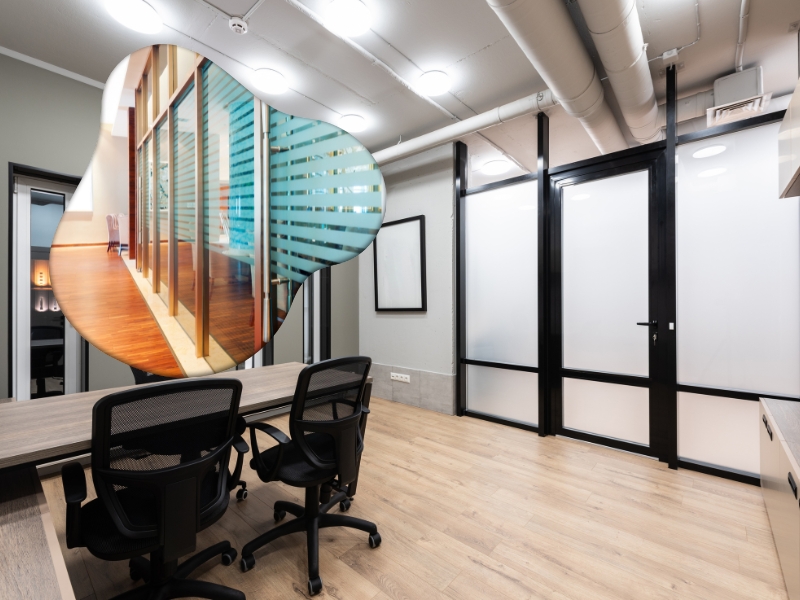 Modern office interior with glass partitions, creating open and collaborative workspaces.